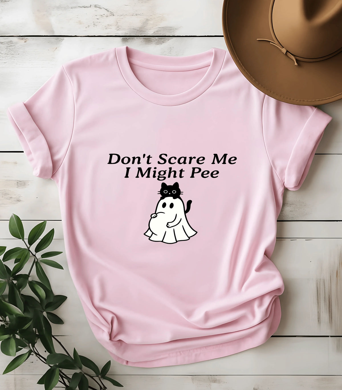 Pink t-shirt with funny cat graphic and text 'Don't Scare Me I Might Pee'