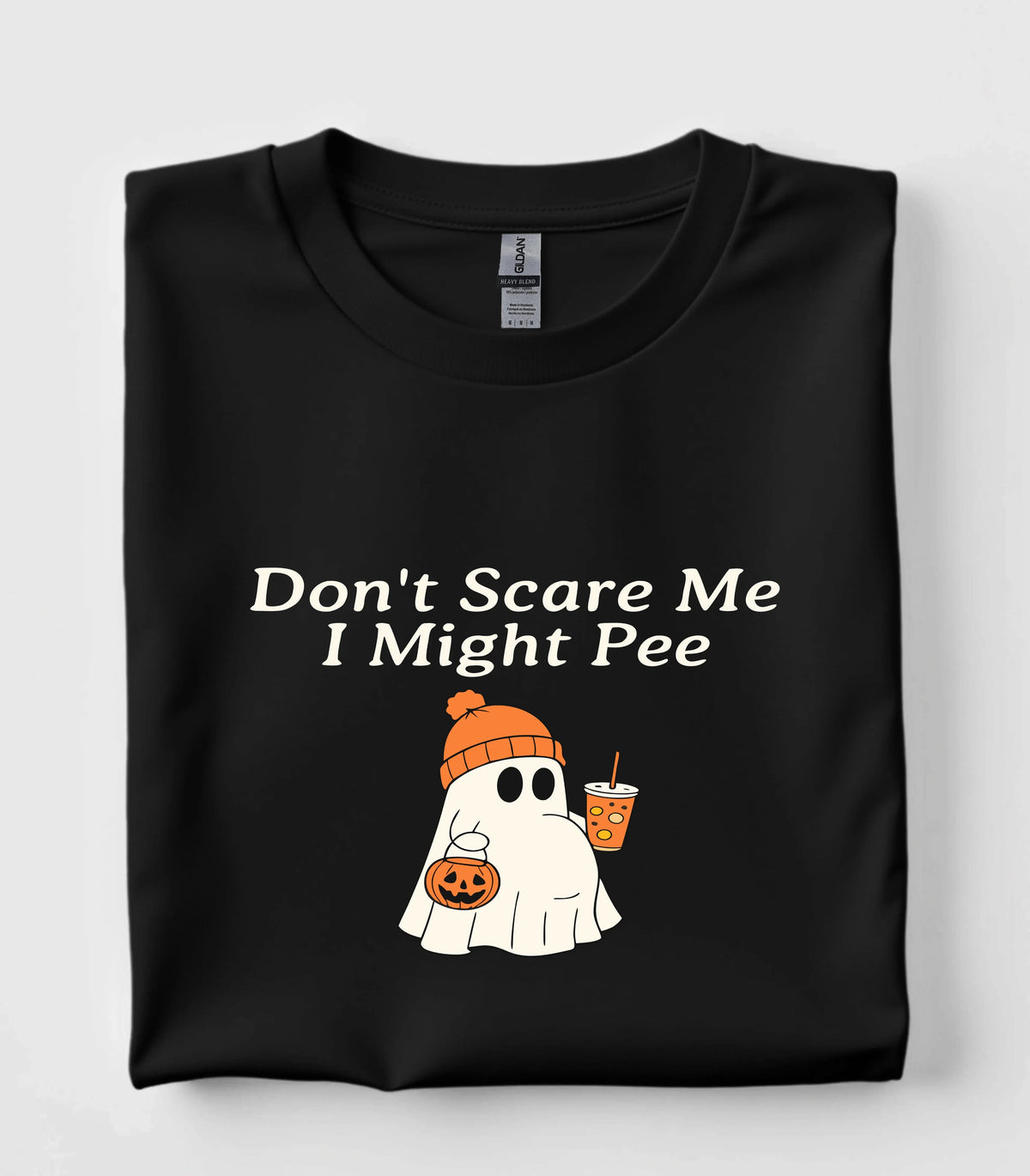 Funny ghost graphic tee with 'Don't Scare Me I Might Pee' text