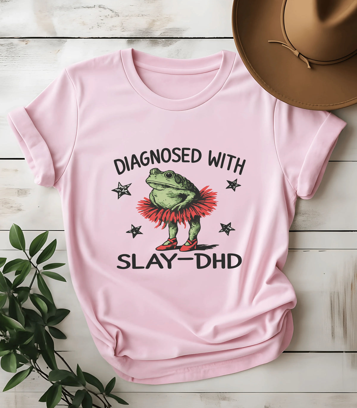 Funny frog graphic tee with 'Diagnosed with Slay-DHD' text on pink shirt