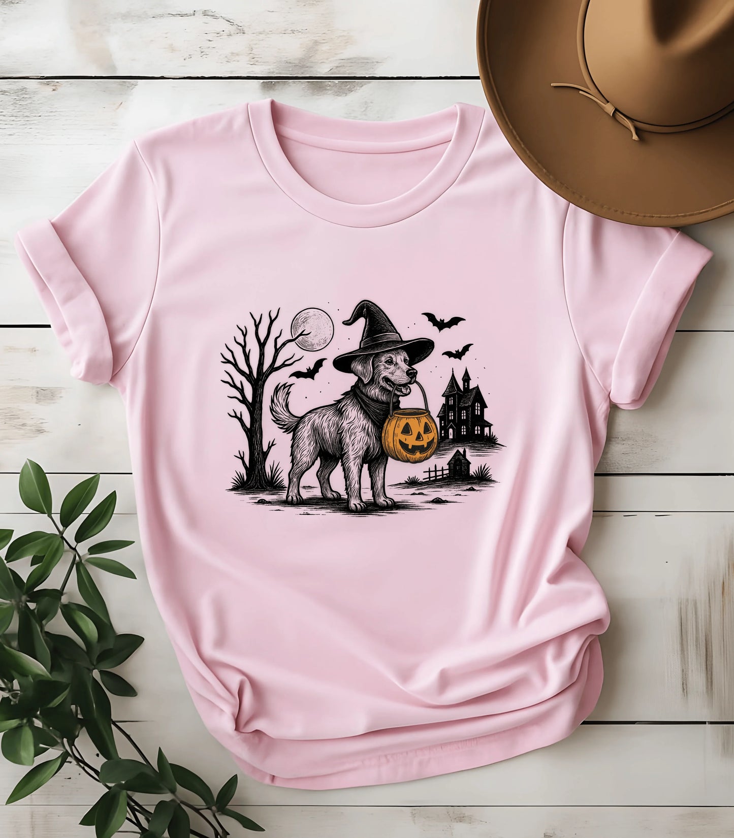 Halloween dog in witch hat graphic tee on pink shirt