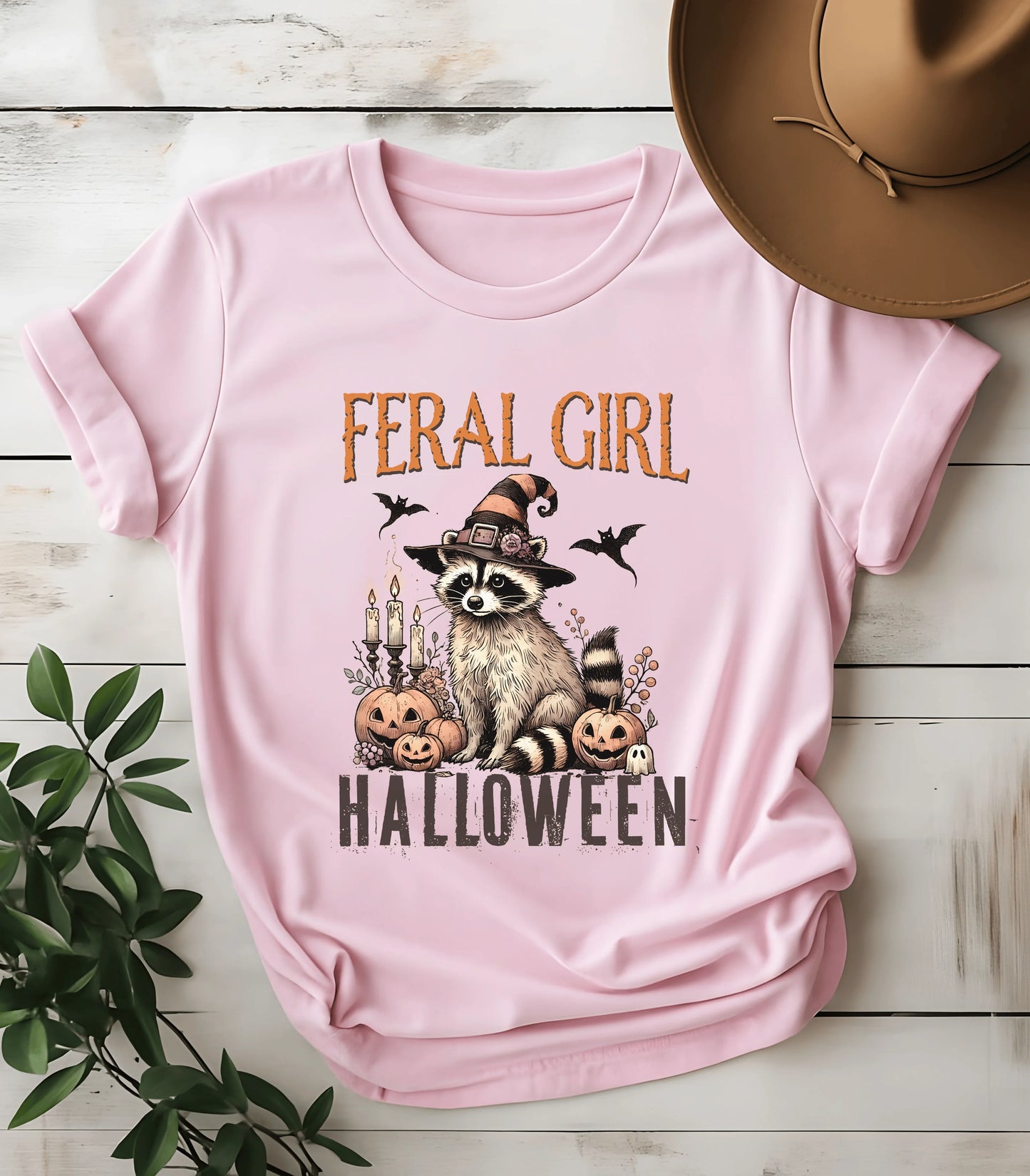 Feral Girl Halloween raccoon graphic tee on pink shirt