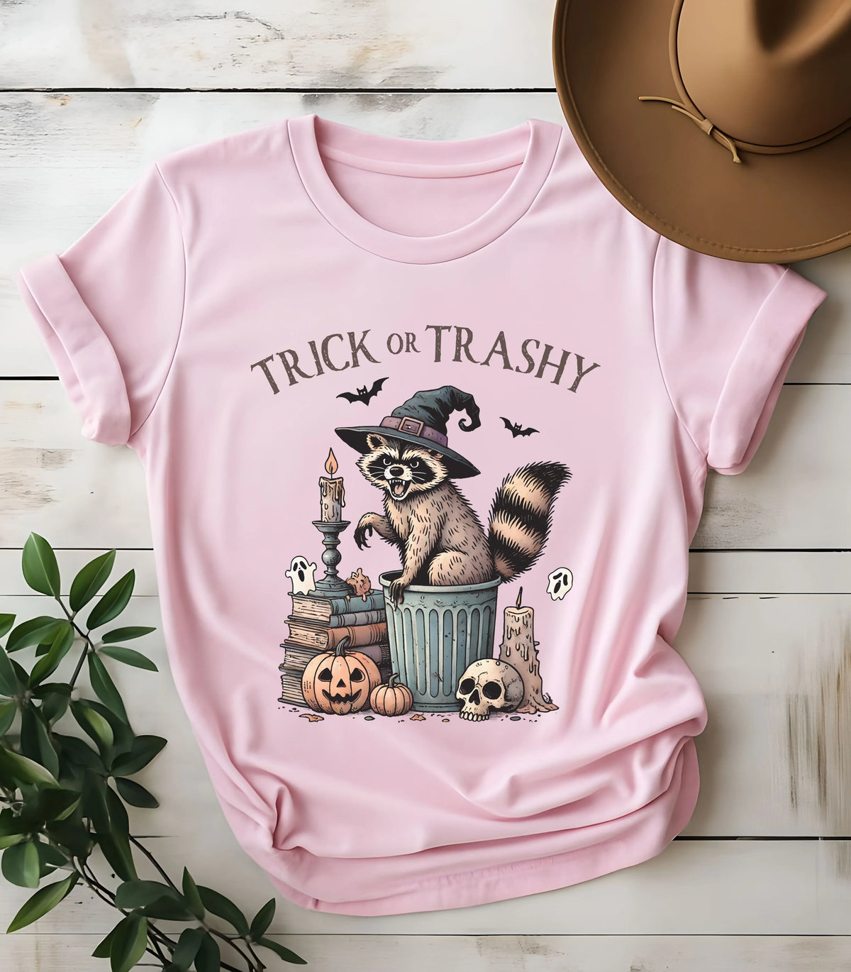 Funny raccoon Halloween graphic tee with 'Trick or Trashy' text