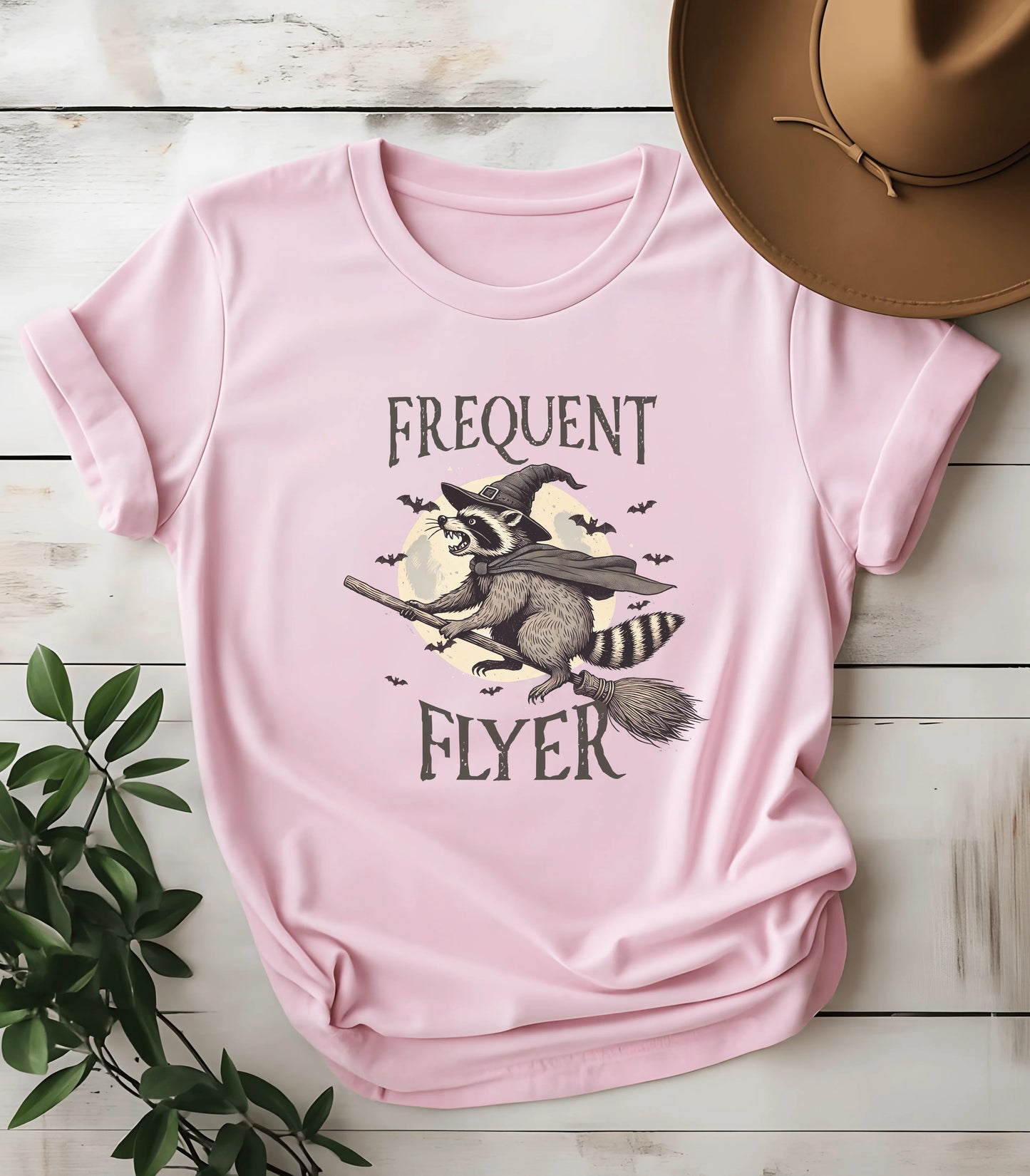 Funny raccoon witch graphic tee on pink t-shirt