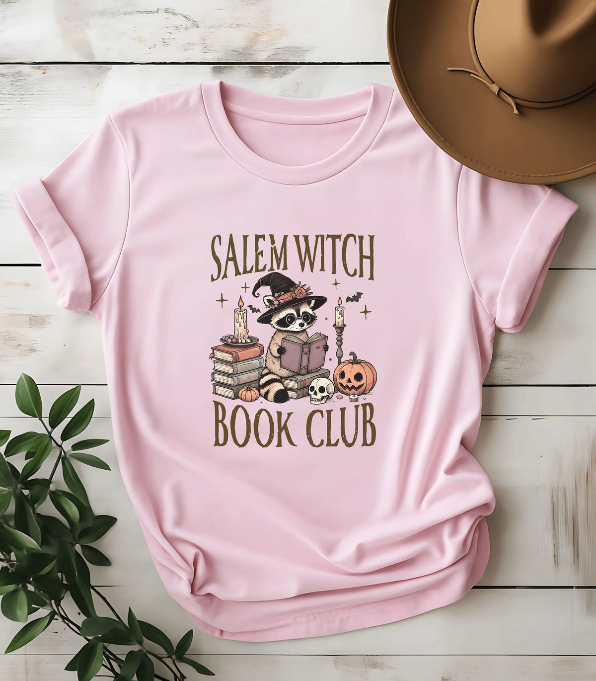 Salem Witch Book Club raccoon graphic tee on pink shirt
