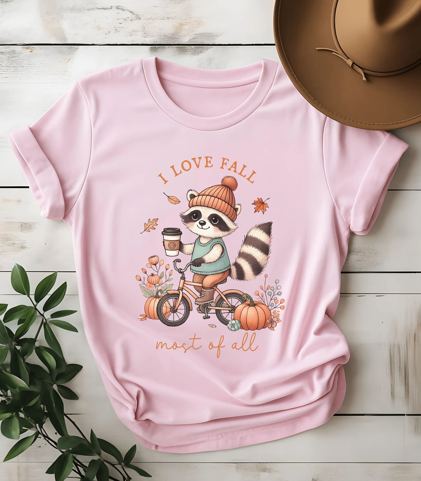 Raccoon on bike with coffee fall graphic tee