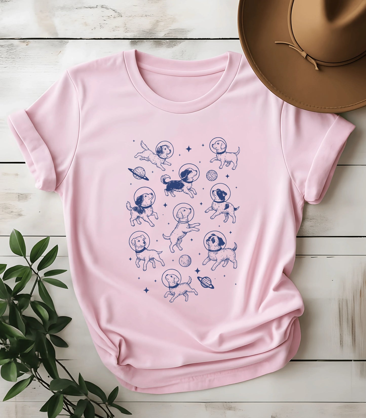 Funny dog graphic tee with space-themed design on pink shirt