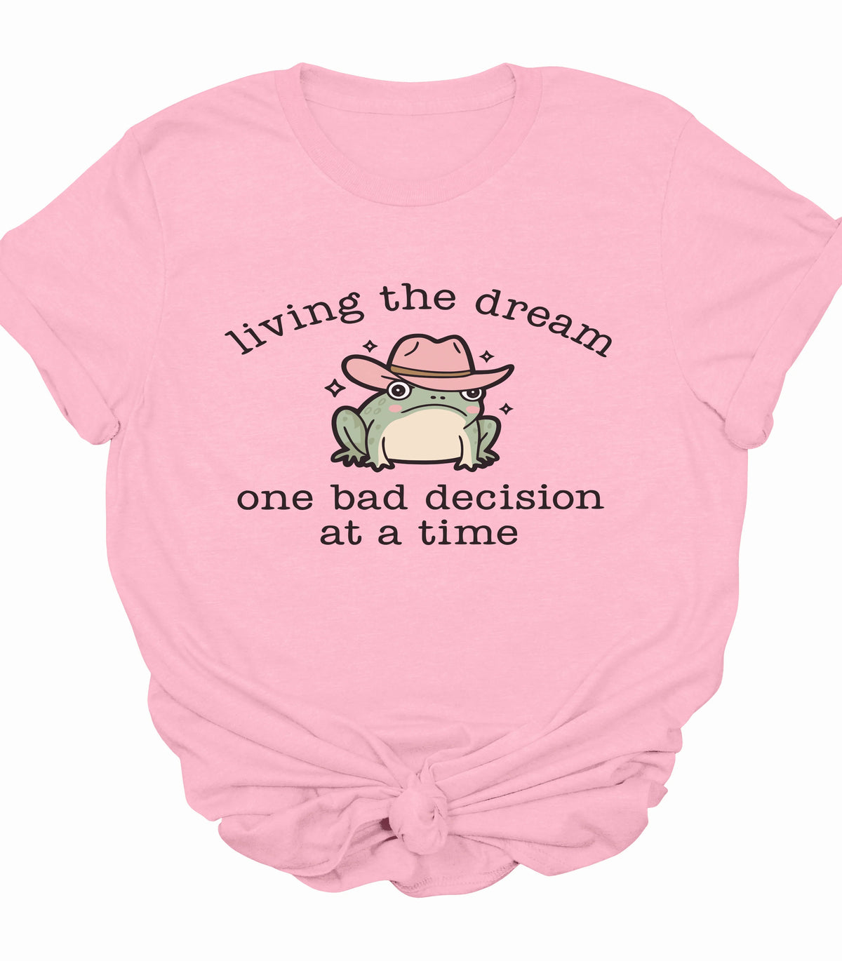 Funny frog graphic tee with cowboy hat and 'living the dream' text on pink shirt