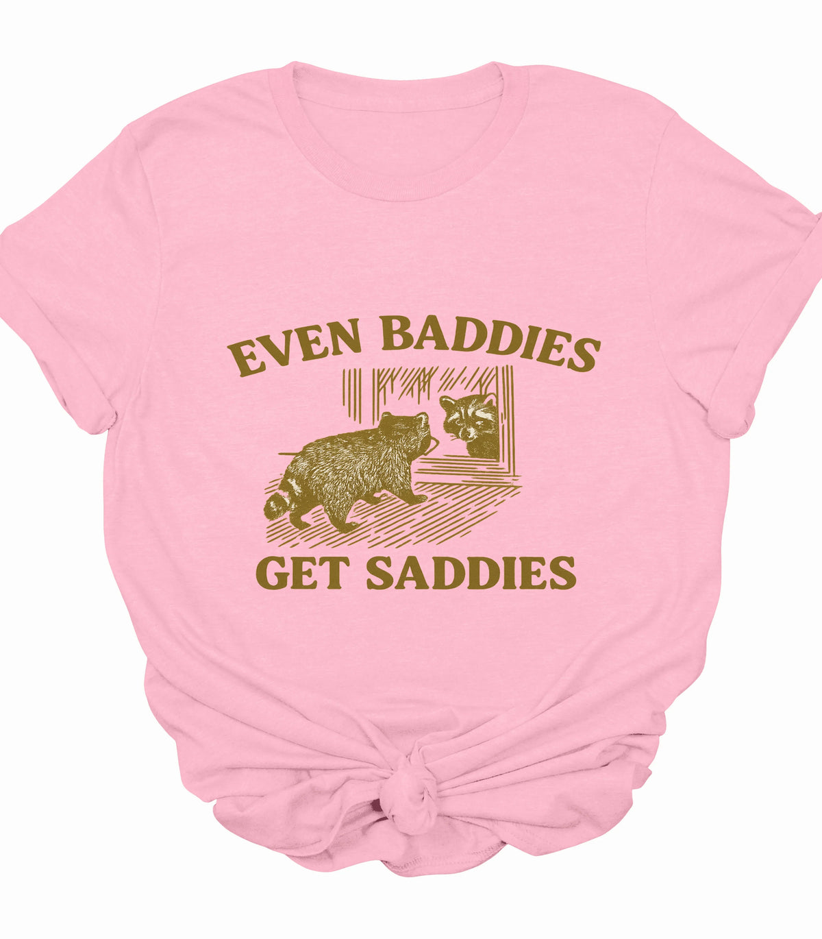 Pink t-shirt with raccoon graphic and 'Even Baddies Get Saddies' text