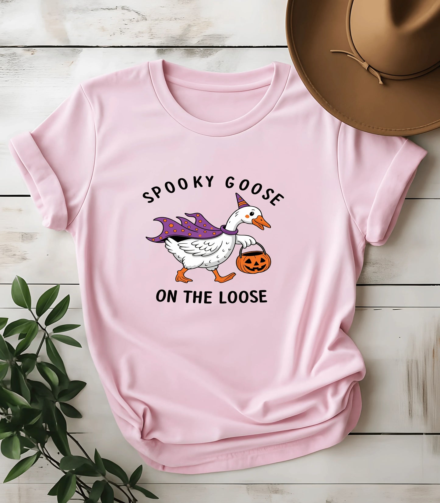 Spooky goose Halloween graphic tee on pink shirt
