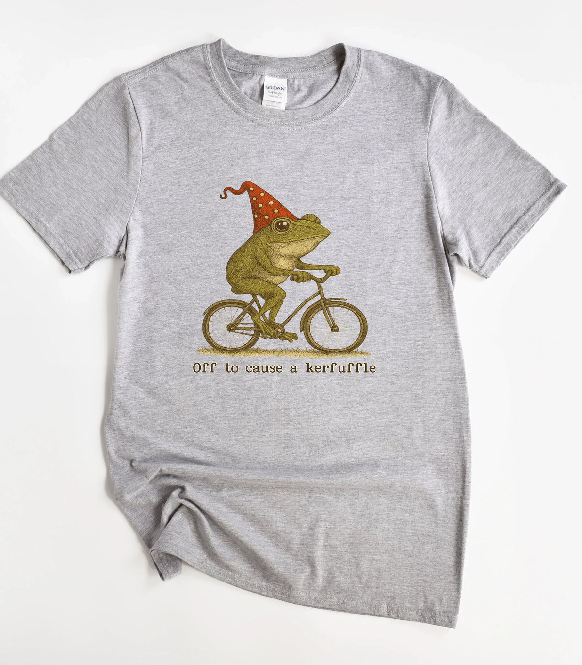 Funny frog on bike graphic tee with party hat and 'Off to cause a kerfuffle' text