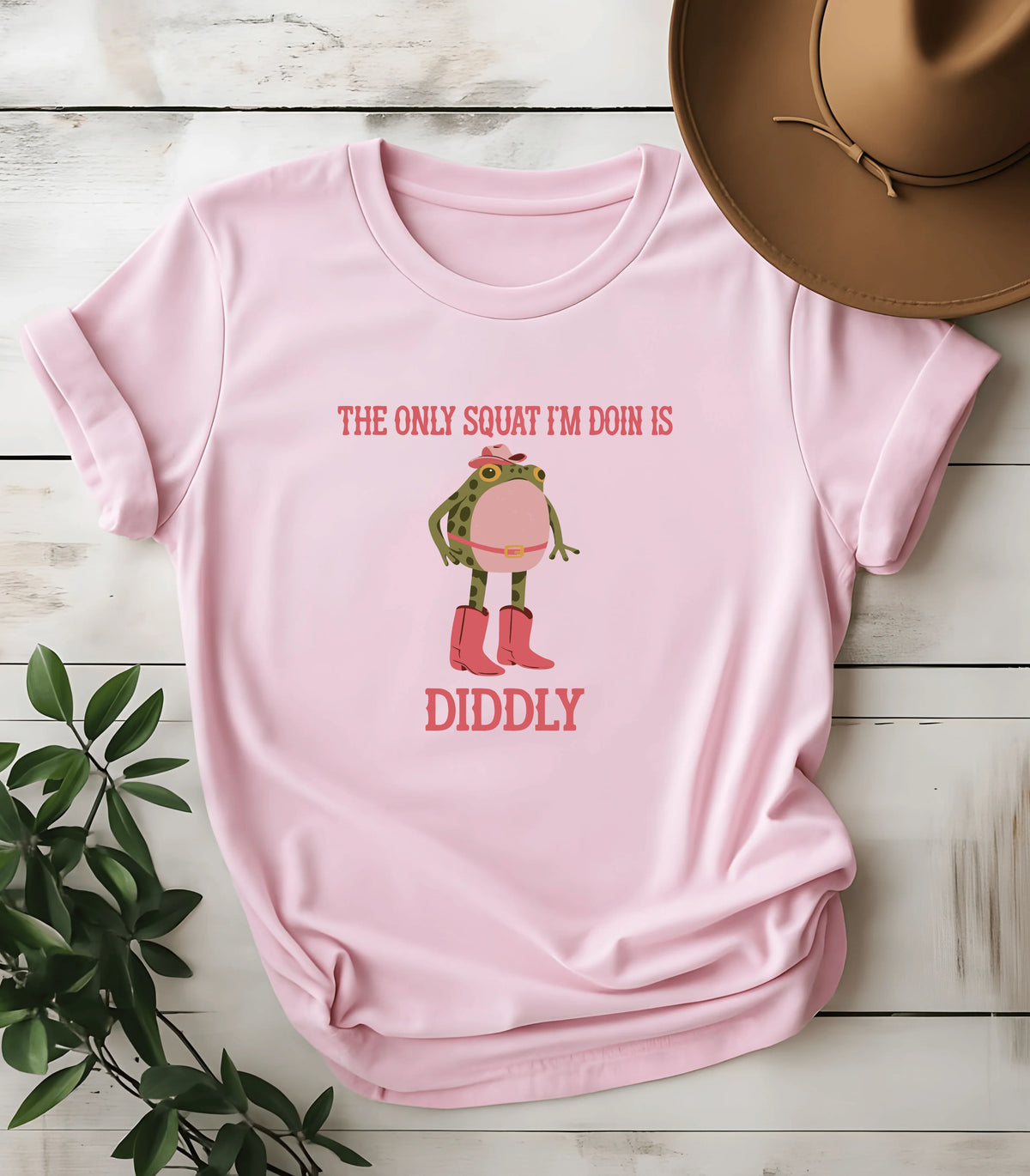 Funny frog graphic tee with cowboy boots and hat on pink shirt