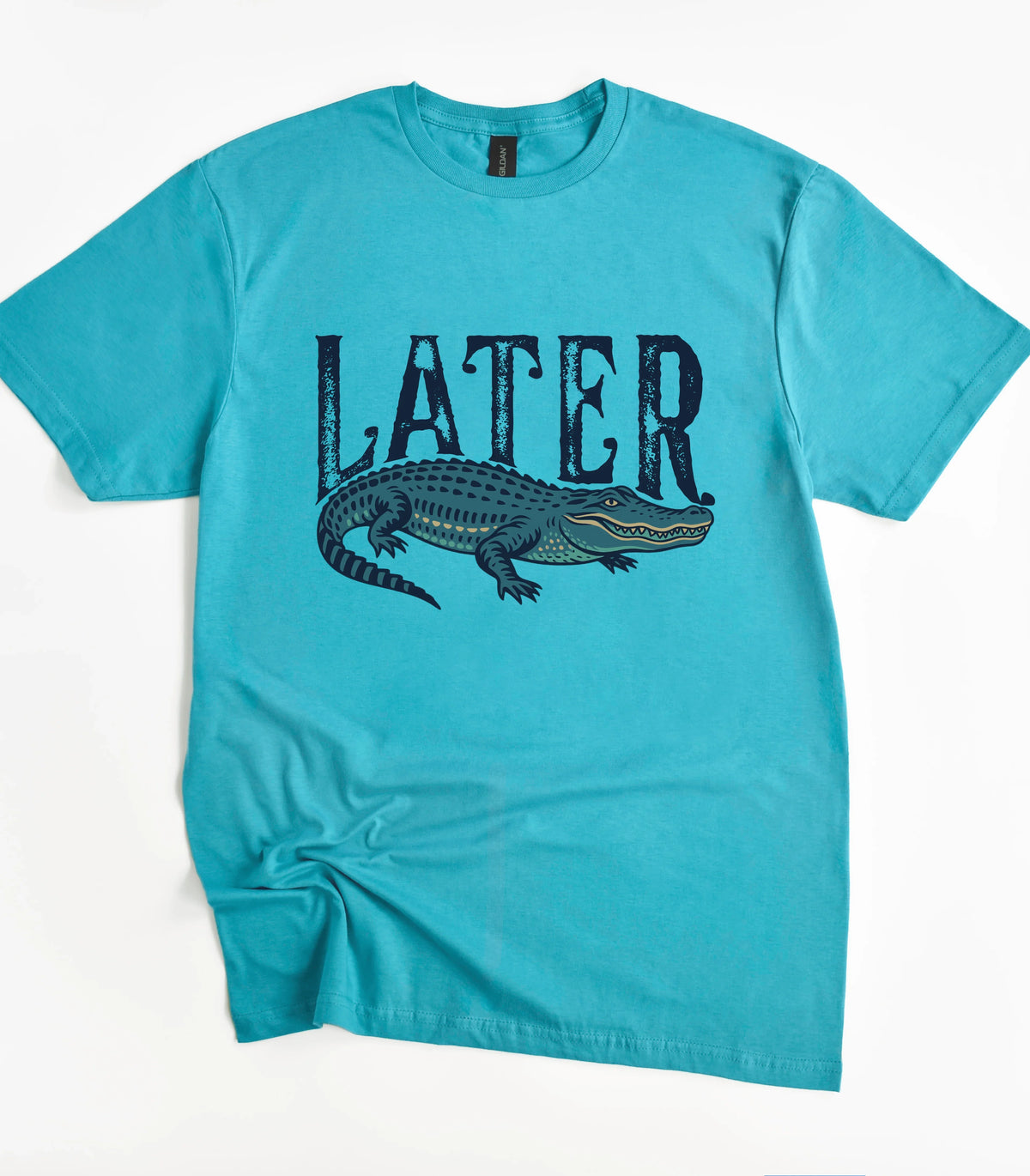 Funny alligator graphic tee with 'LATER' text on teal shirt