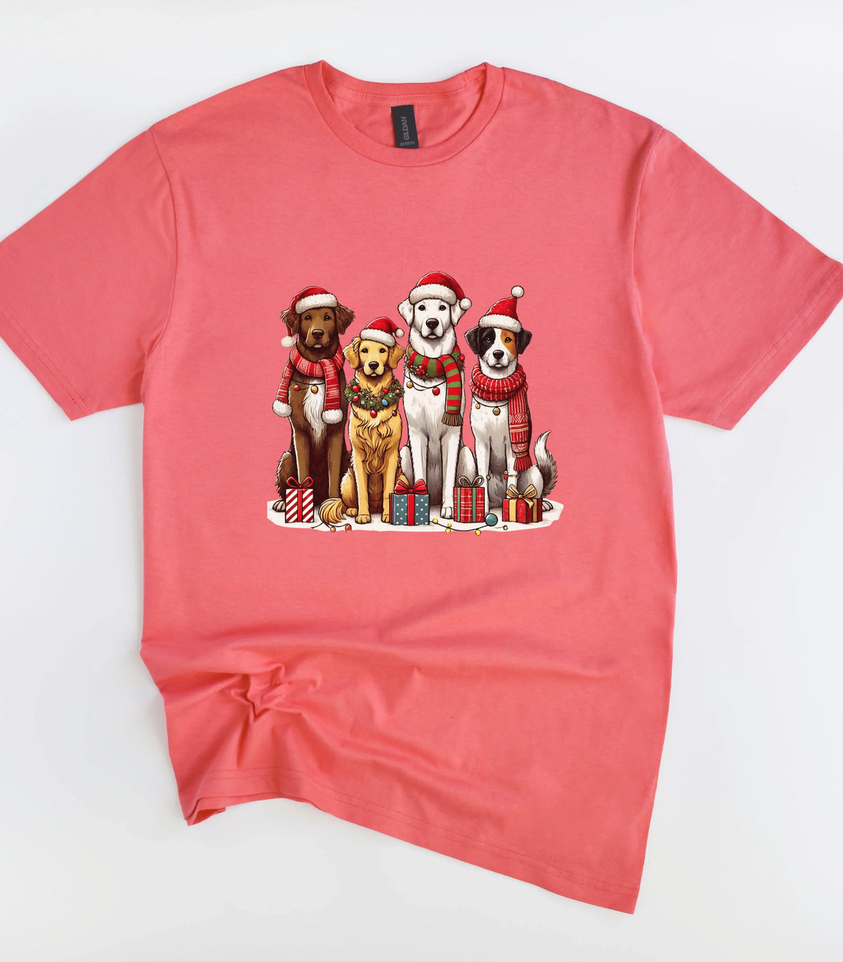 Funny dog graphic tee with Christmas hats and gifts on coral shirt