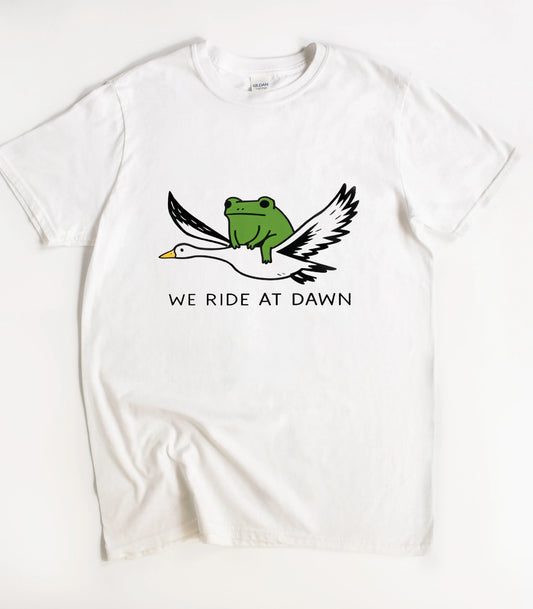 We Ride At Dawn Funny T-Shirt
