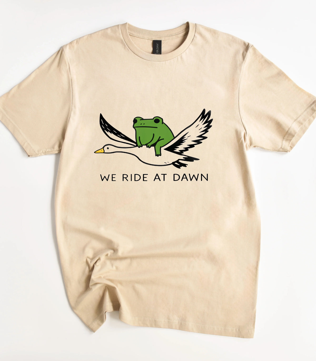 Funny frog riding goose graphic t-shirt with 'We Ride at Dawn' text
