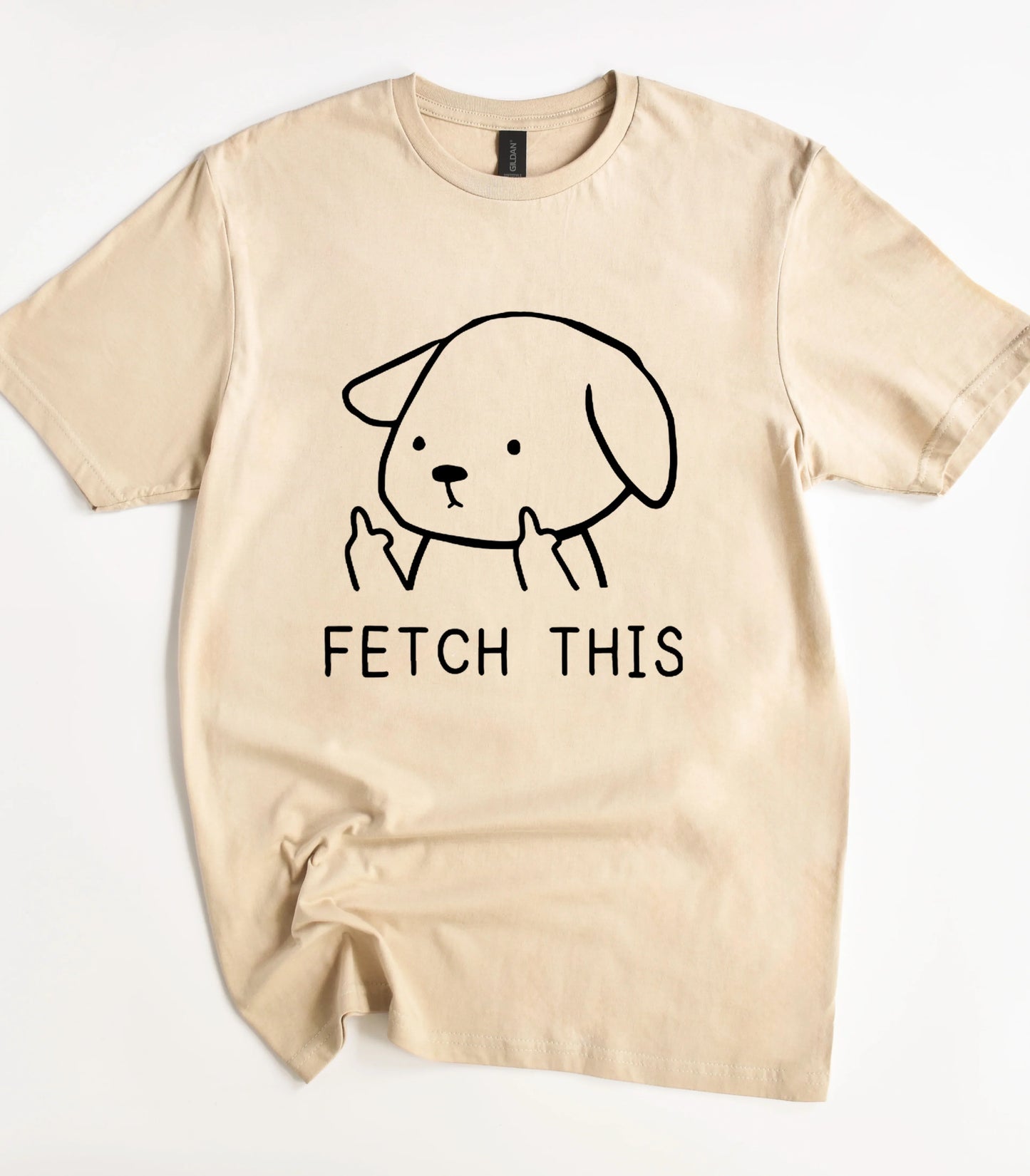 Funny dog graphic tee with 'FETCH THIS' text on beige shirt
