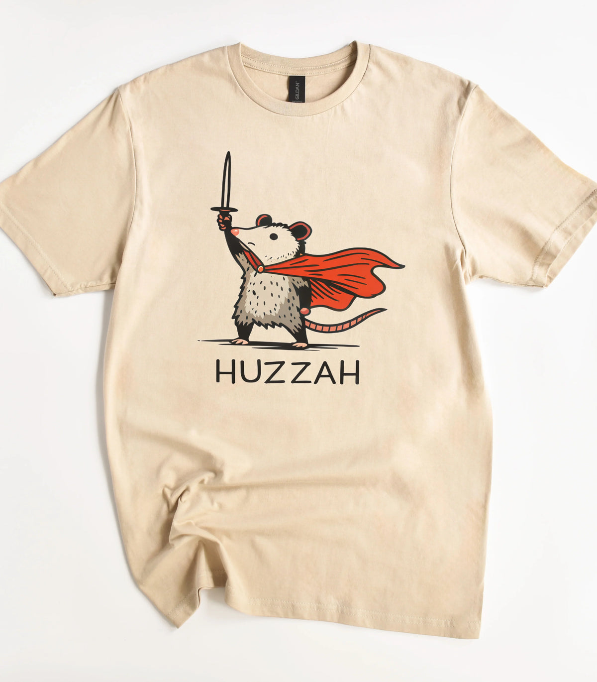 Funny opossum graphic tee with red cape and sword, text HUZZAH