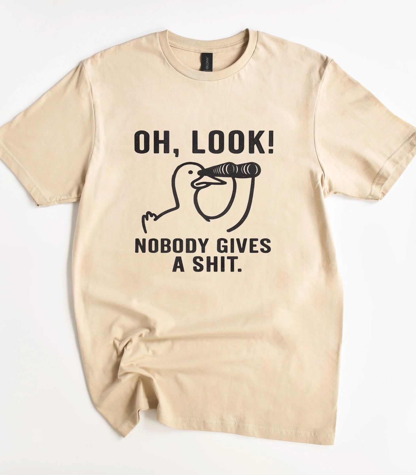 Funny graphic t-shirt with duck and text 'Oh, Look! Nobody Gives a Shit.'