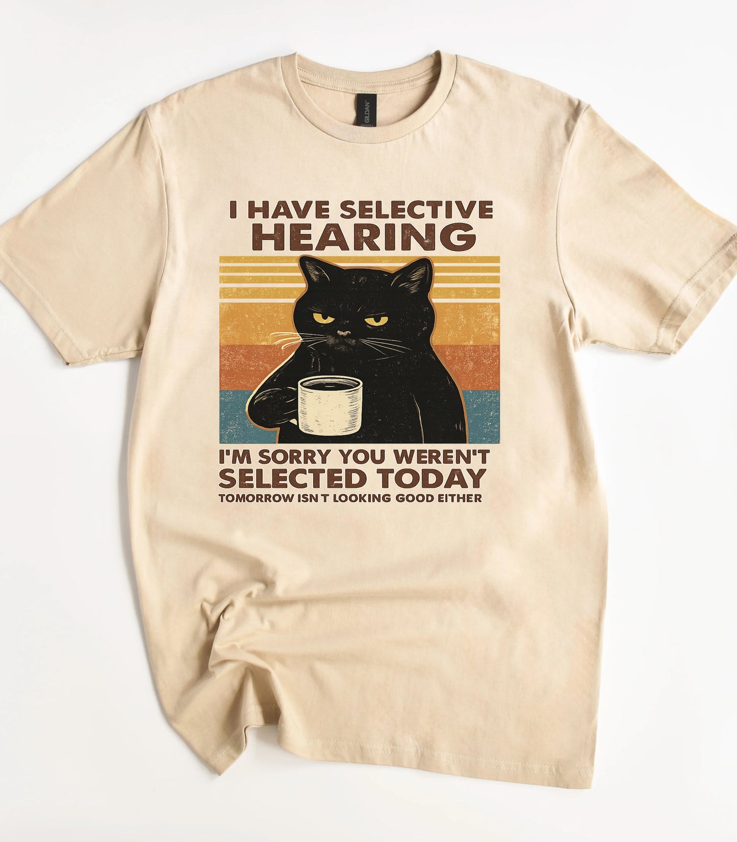 Funny cat graphic tee with selective hearing text and black cat holding coffee mug