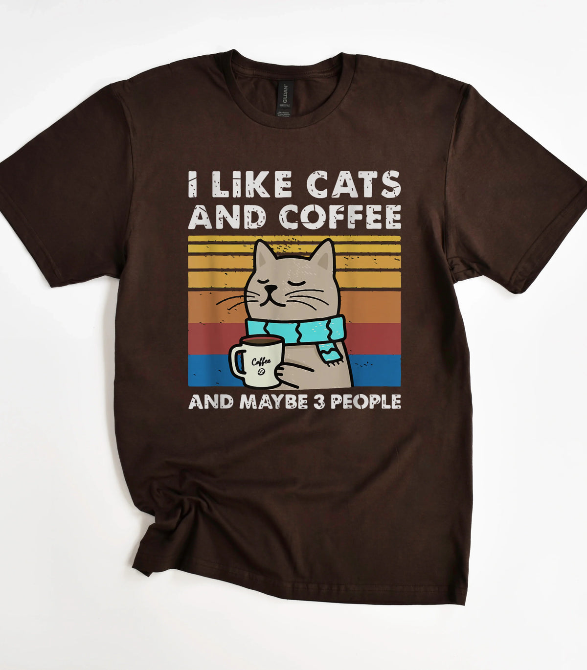 Funny cat graphic tee with coffee mug design on brown shirt