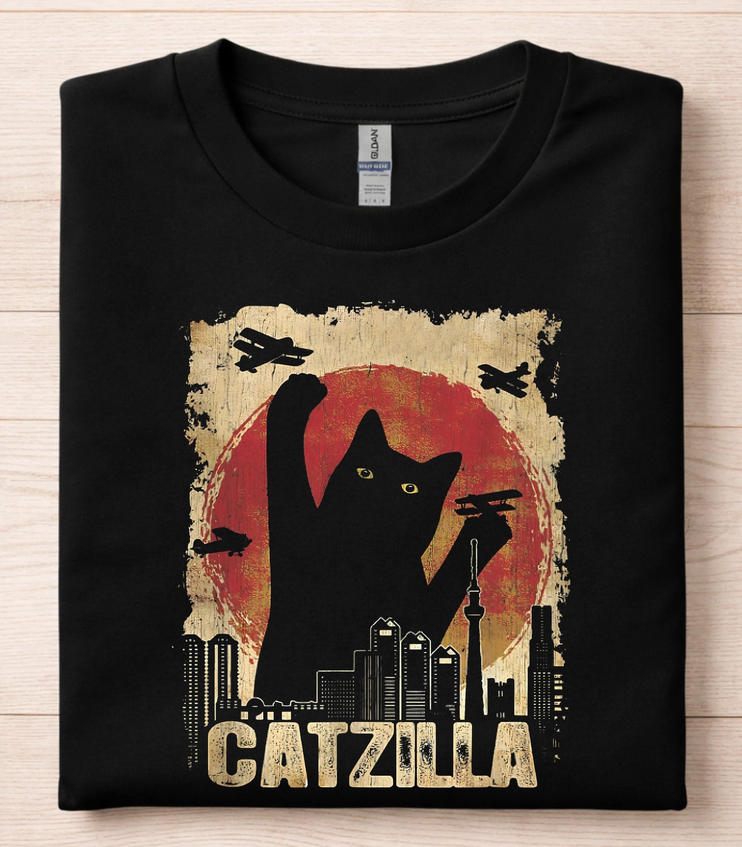 Catzilla funny cat graphic tee with city skyline and planes on black t-shirt