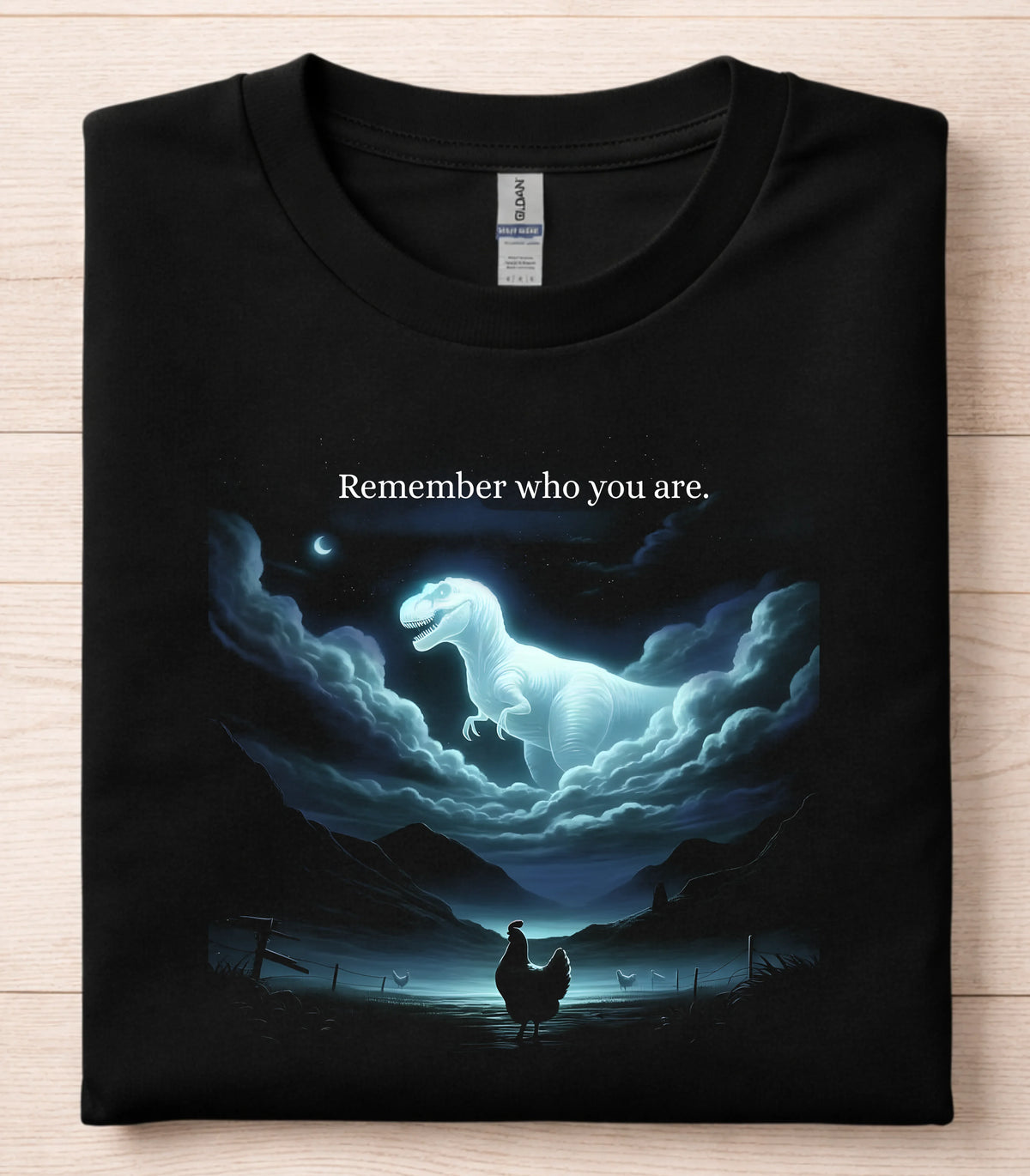 Funny dinosaur graphic tee with glowing T-Rex and chicken under moonlight