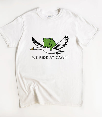 We Ride At Dawn Funny T-Shirt