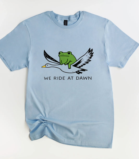We Ride At Dawn Funny T-Shirt