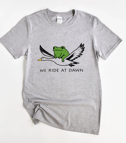 We Ride At Dawn Funny T-Shirt